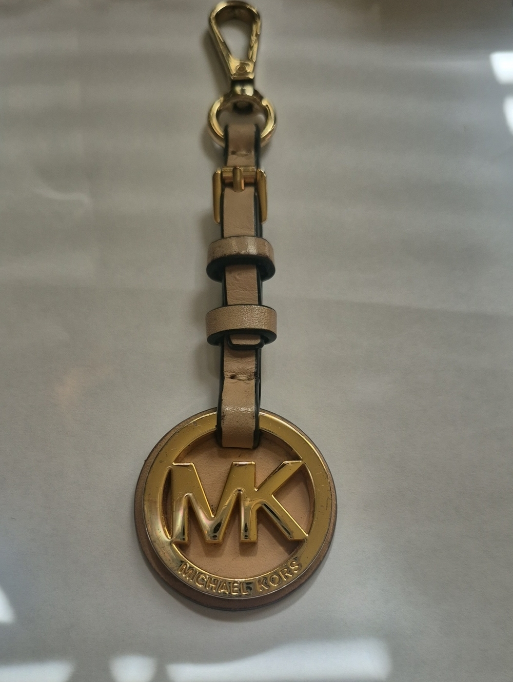 Michael Kors Gold MK Round Charm with Beige Leather Strap